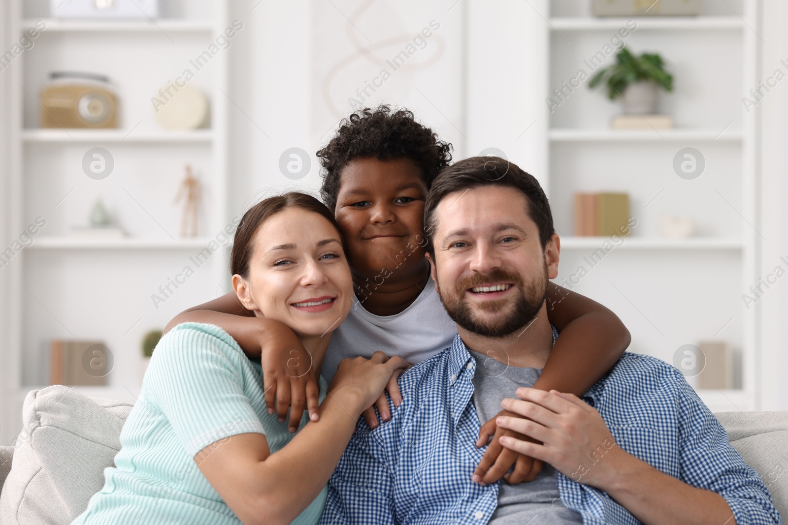 Adoption. Happy parents and their son at home Photo of Adoption. Happy parents and their son at home
