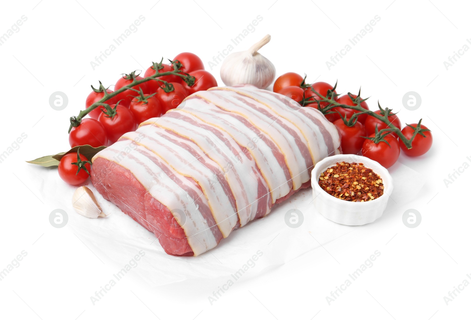 Piece of raw beef meat, tomatoes and spices isolated on white Photo of Piece of raw beef meat, tomatoes and spices isolated on white