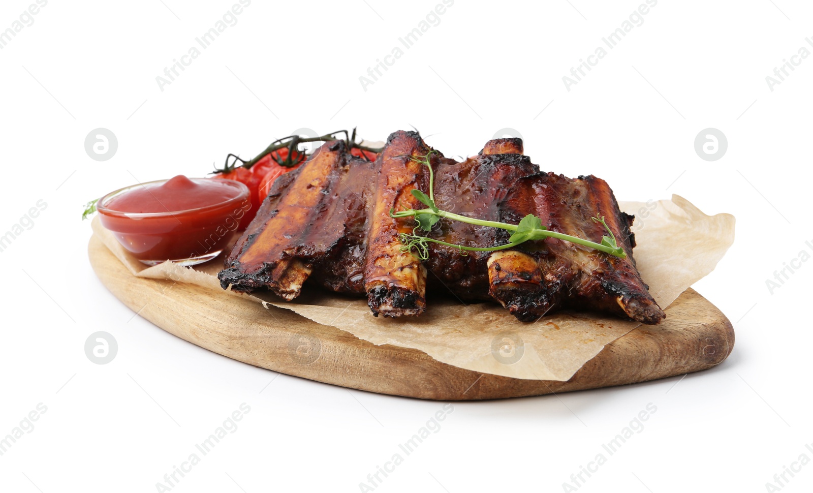 Roasted beef ribs with microgreens, tomatoes and sauce isolated on white Photo of Roasted beef ribs with microgreens, tomatoes and sauce isolated on white