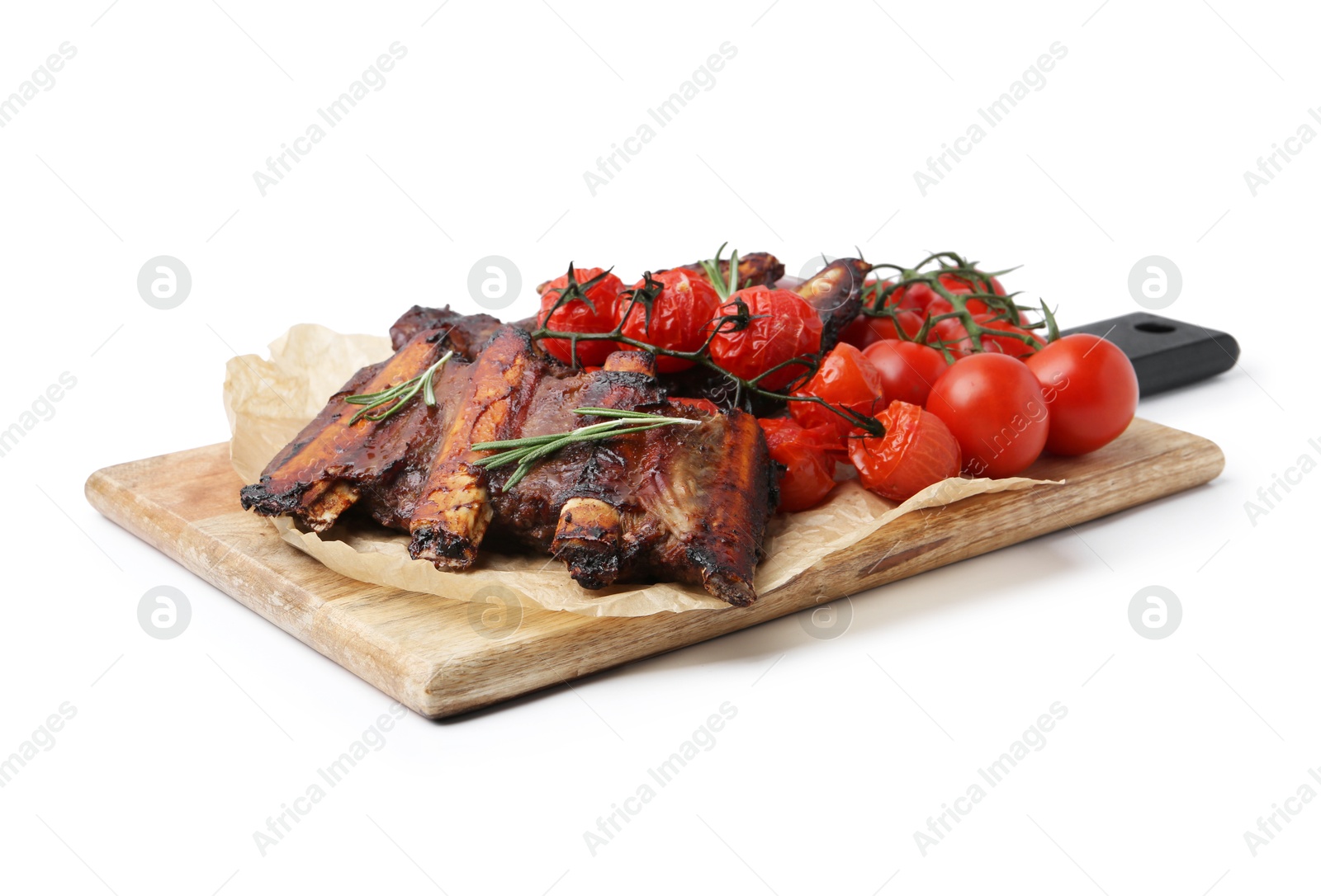 Roasted beef ribs with rosemary and tomatoes isolated on white Photo of Roasted beef ribs with rosemary and tomatoes isolated on white