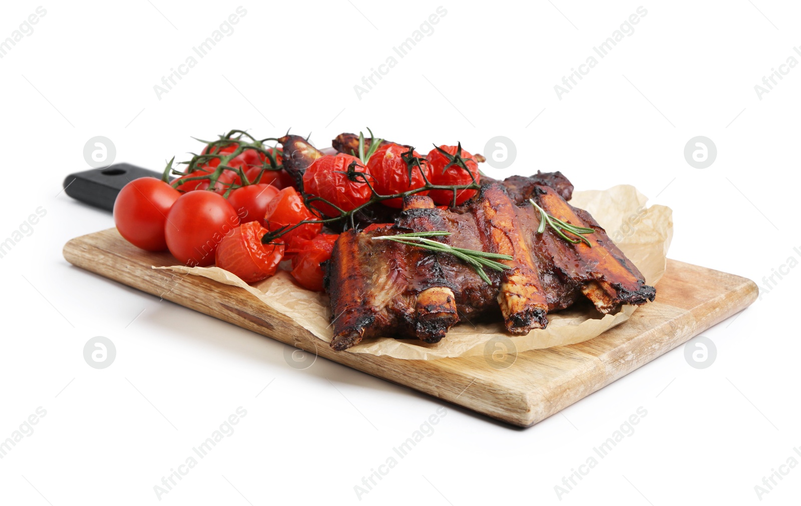 Roasted beef ribs with rosemary and tomatoes isolated on white Photo of Roasted beef ribs with rosemary and tomatoes isolated on white