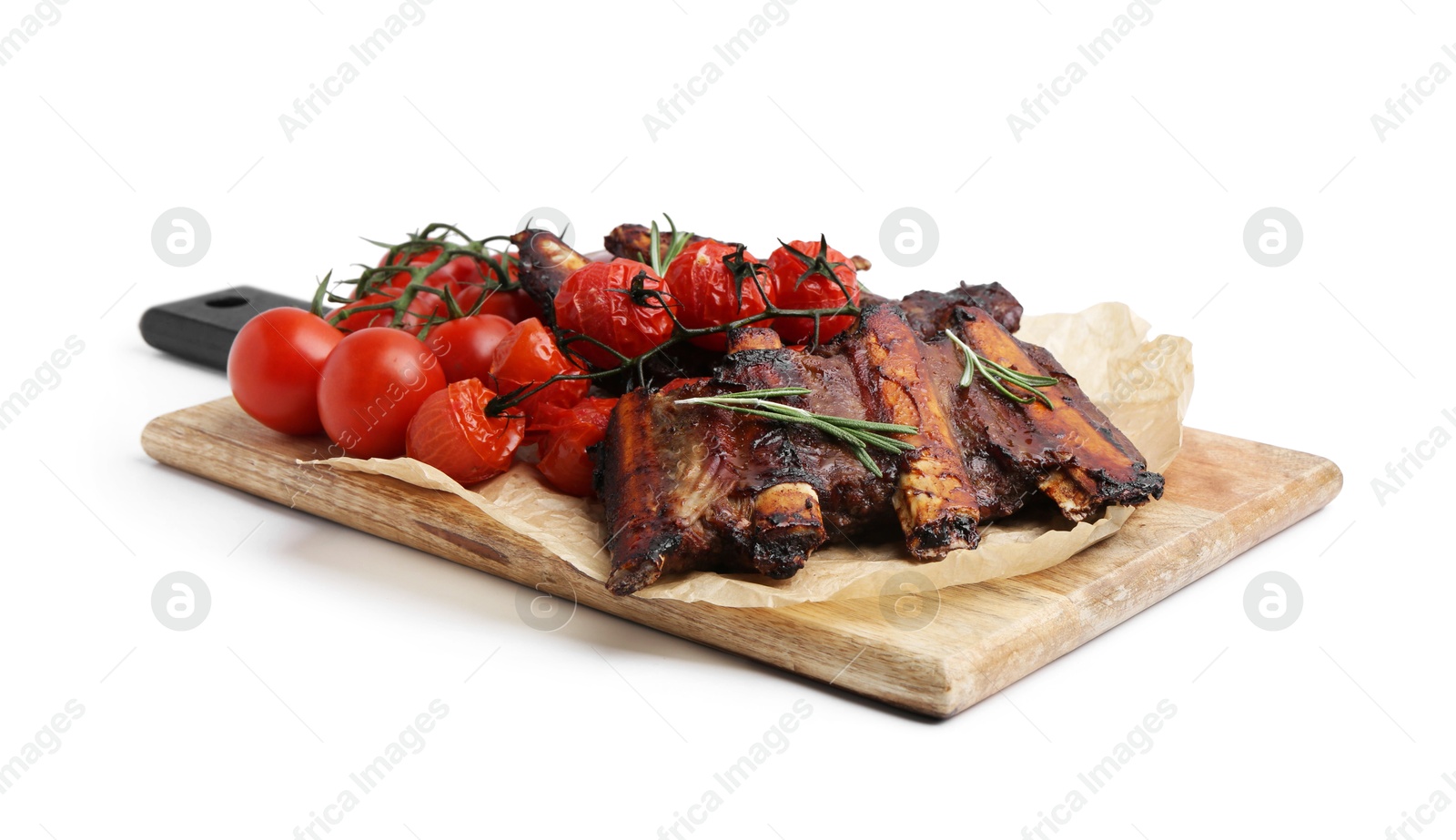Roasted beef ribs with rosemary and tomatoes isolated on white Photo of Roasted beef ribs with rosemary and tomatoes isolated on white
