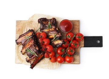 Photo of Roasted beef ribs with rosemary, tomatoes and sauce isolated on white, top view