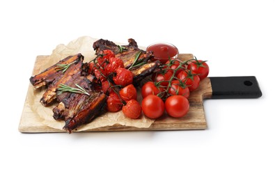 Photo of Roasted beef ribs with rosemary, tomatoes and sauce isolated on white