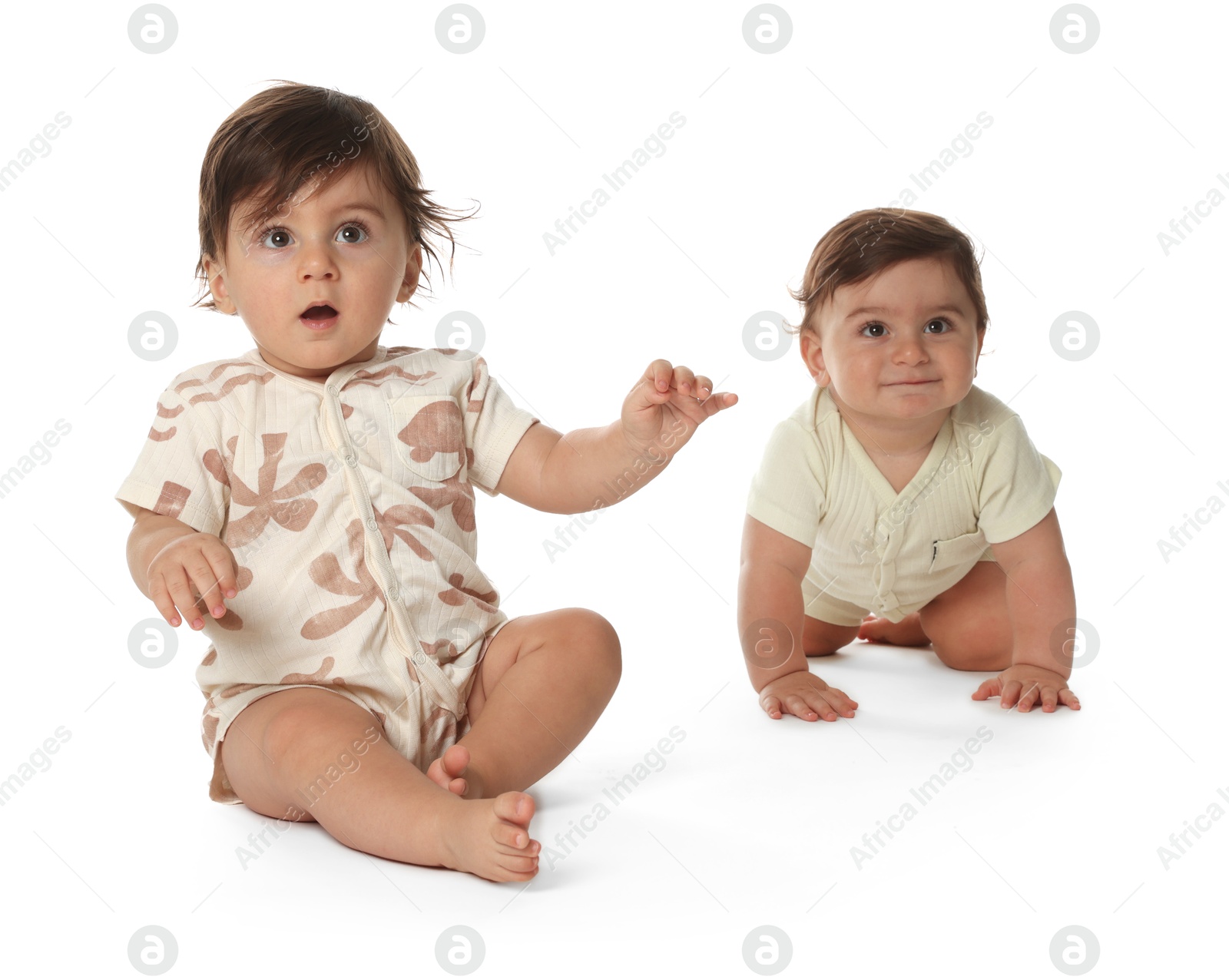 Cute little twin babies on white background Photo of Cute little twin babies on white background