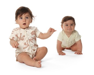 Photo of Cute little twin babies on white background