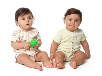 Photo of Cute little twin babies on white background