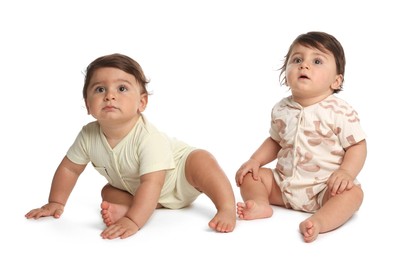 Photo of Cute little twin babies on white background