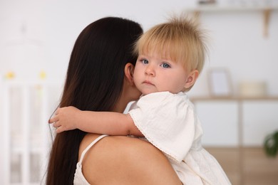 Photo of Mother and her cute little baby in room
