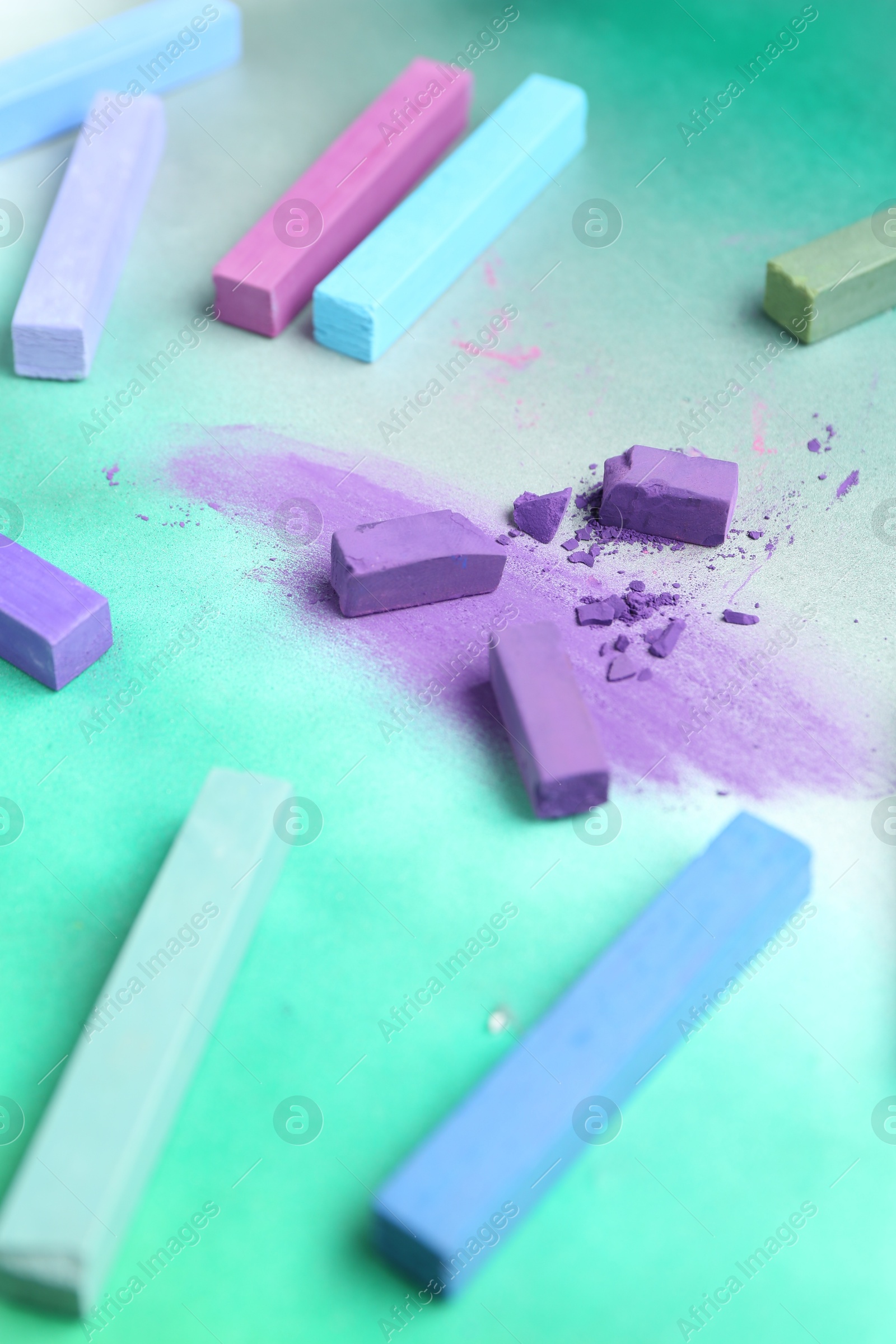 Colorful chalk pastels on color background, closeup Photo of Colorful chalk pastels on color background, closeup