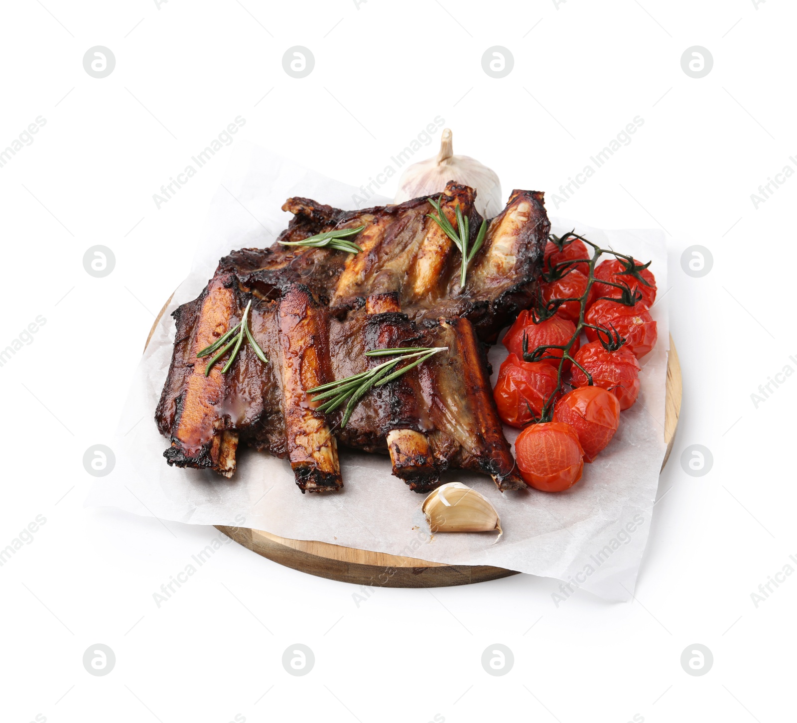 Photo of Roasted beef ribs with spices and tomatoes isolated on white