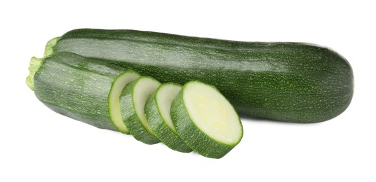 Photo of Whole and cut fresh zucchinis isolated on white