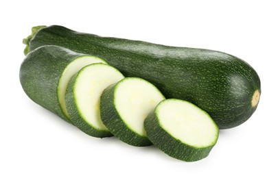 Photo of Whole and cut fresh zucchinis isolated on white