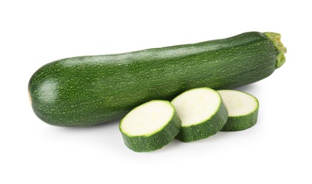 Photo of Whole and cut fresh zucchinis isolated on white