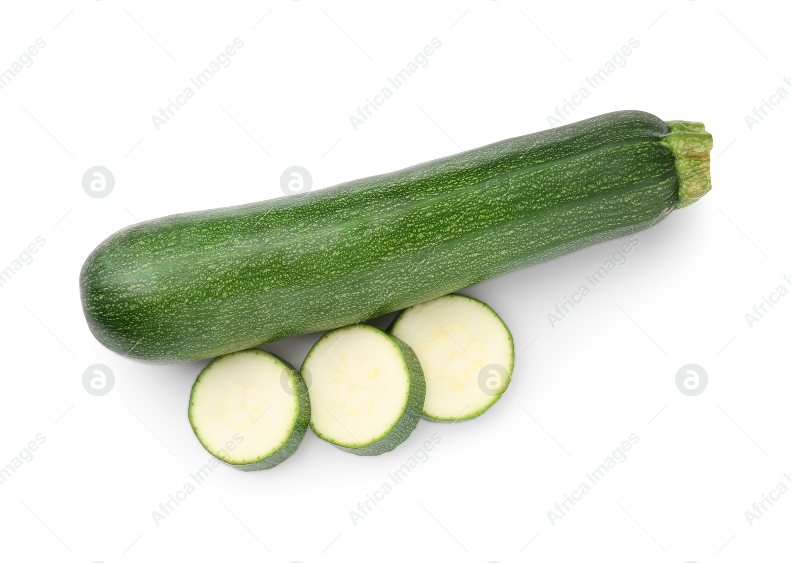 Whole and cut fresh zucchinis isolated on white, top view Photo of Whole and cut fresh zucchinis isolated on white, top view