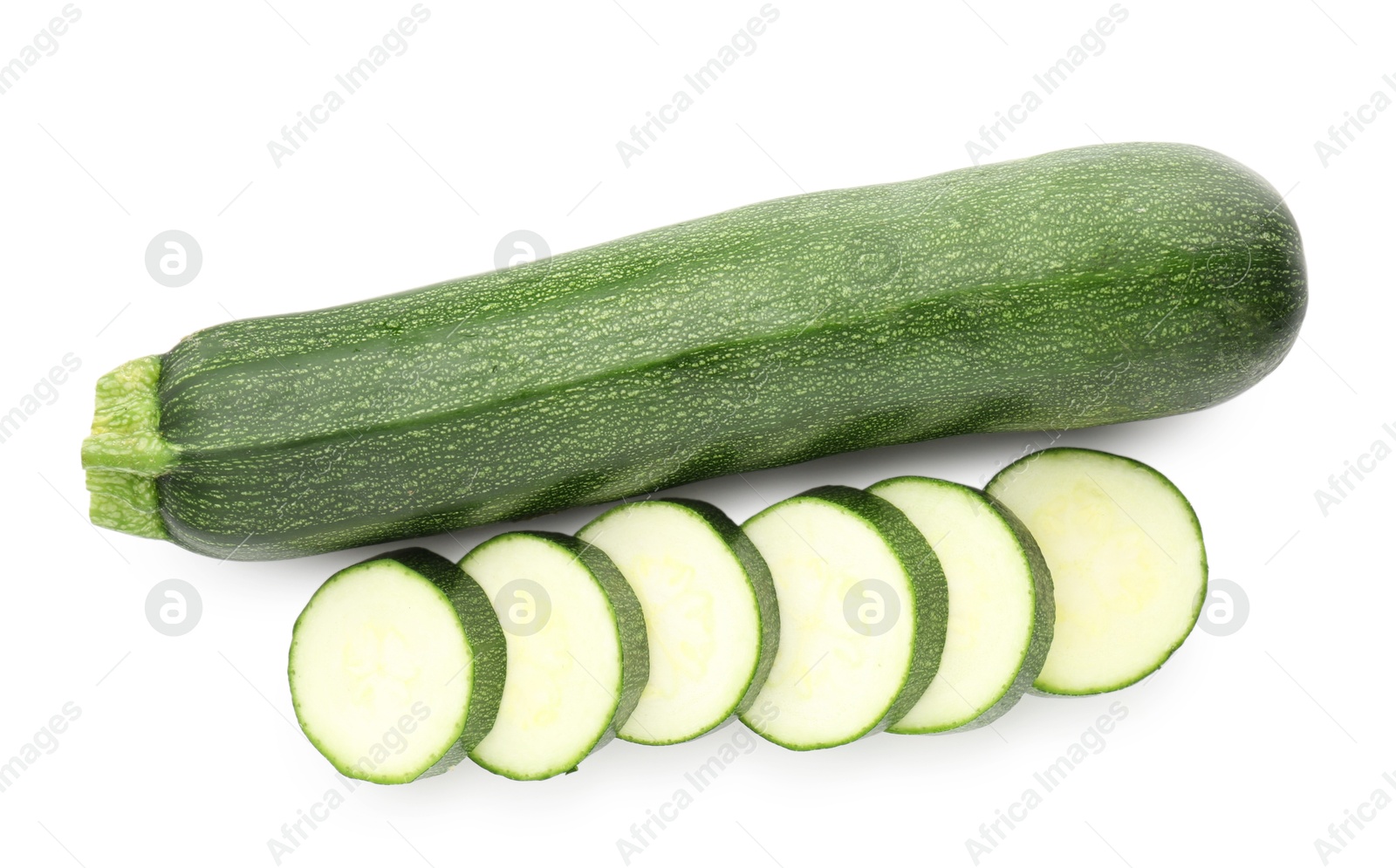 Whole and cut fresh zucchinis isolated on white, top view Photo of Whole and cut fresh zucchinis isolated on white, top view
