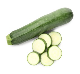 Photo of Whole and cut fresh zucchinis isolated on white, top view
