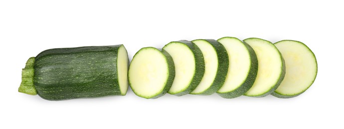 Photo of Pieces of fresh zucchini isolated on white, top view
