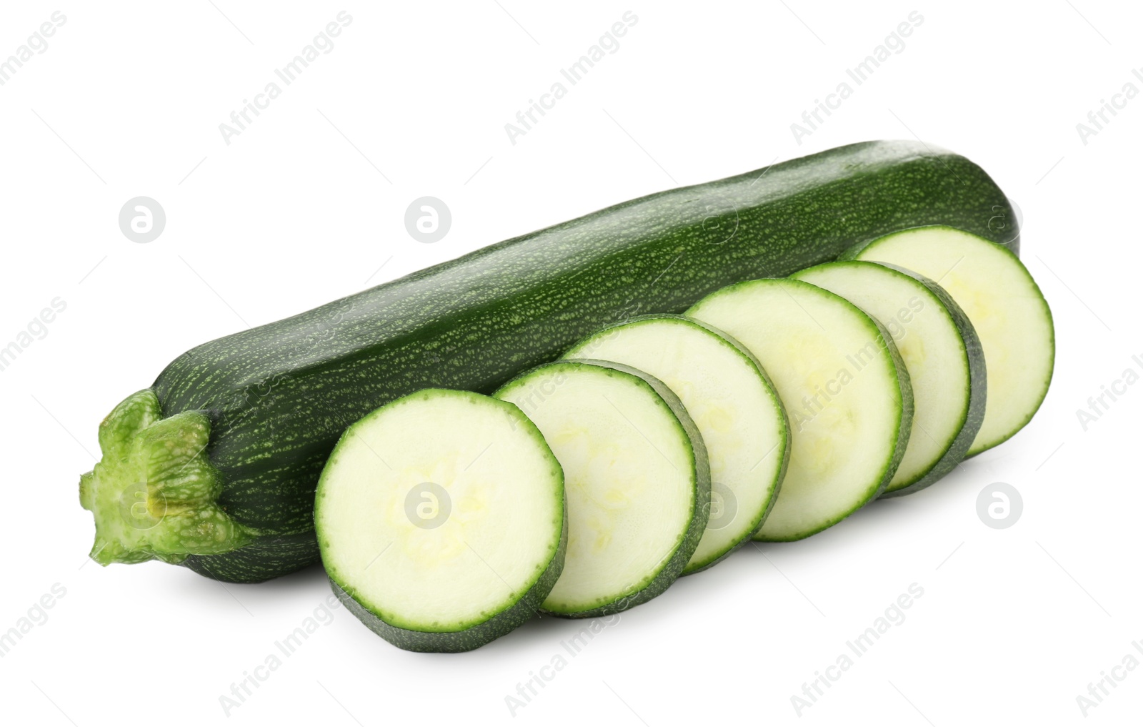 Whole and cut fresh zucchinis isolated on white Photo of Whole and cut fresh zucchinis isolated on white