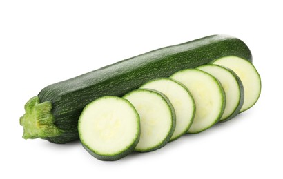 Photo of Whole and cut fresh zucchinis isolated on white