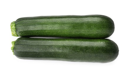 Photo of Fresh ripe zucchinis isolated on white, top view