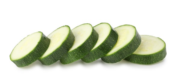 Photo of Pieces of fresh zucchini isolated on white