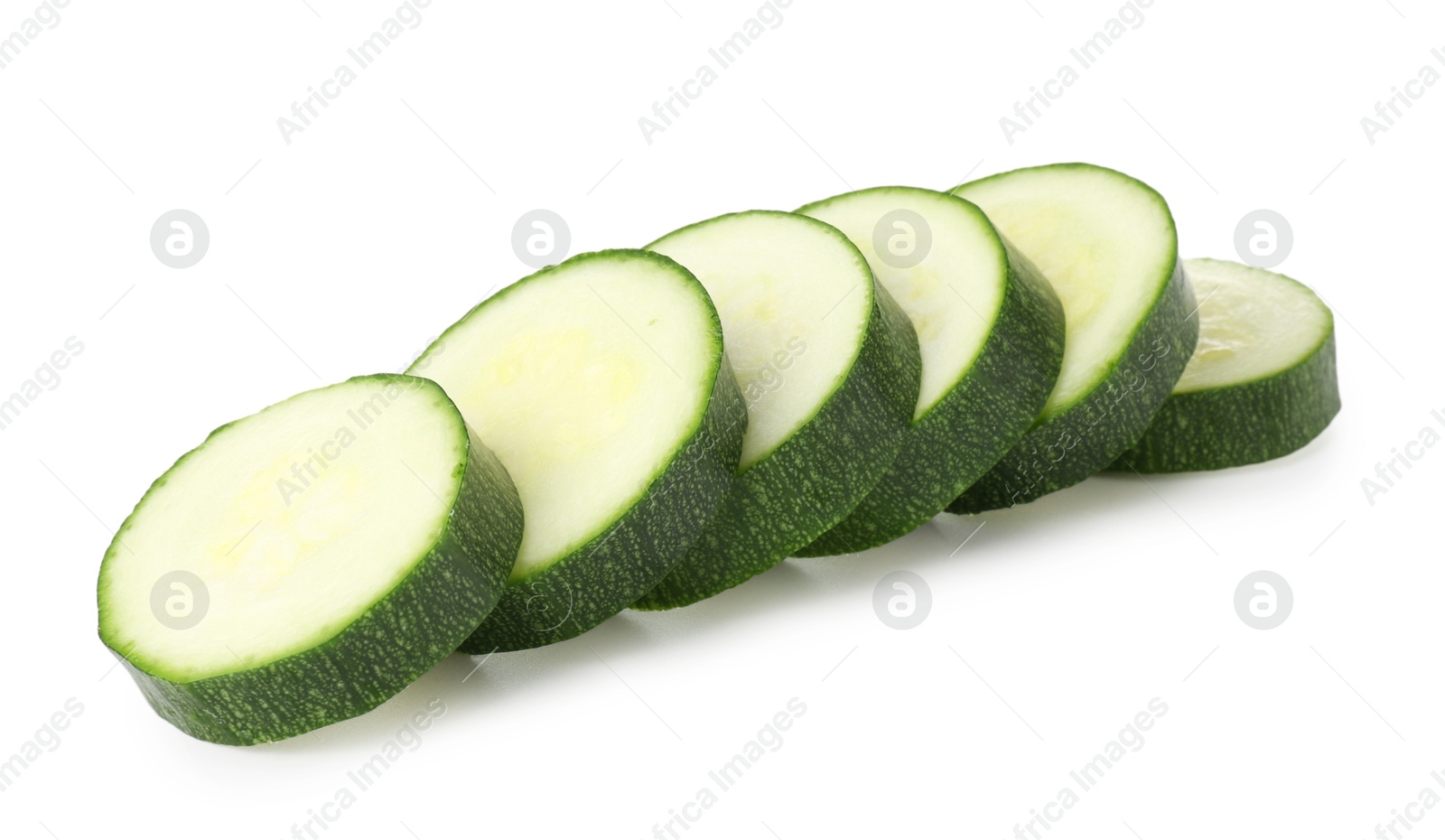Pieces of fresh zucchini isolated on white Photo of Pieces of fresh zucchini isolated on white