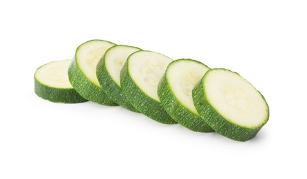 Photo of Pieces of fresh zucchini isolated on white
