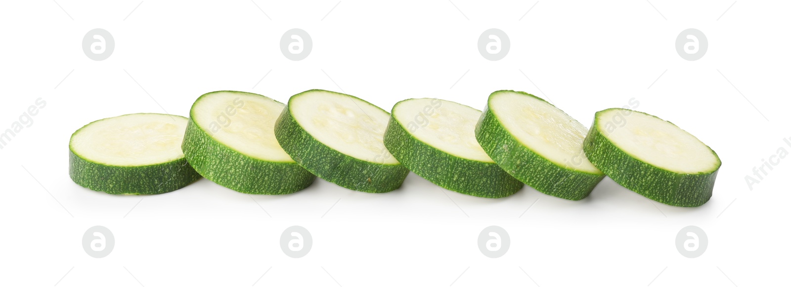 Pieces of fresh zucchini isolated on white Photo of Pieces of fresh zucchini isolated on white