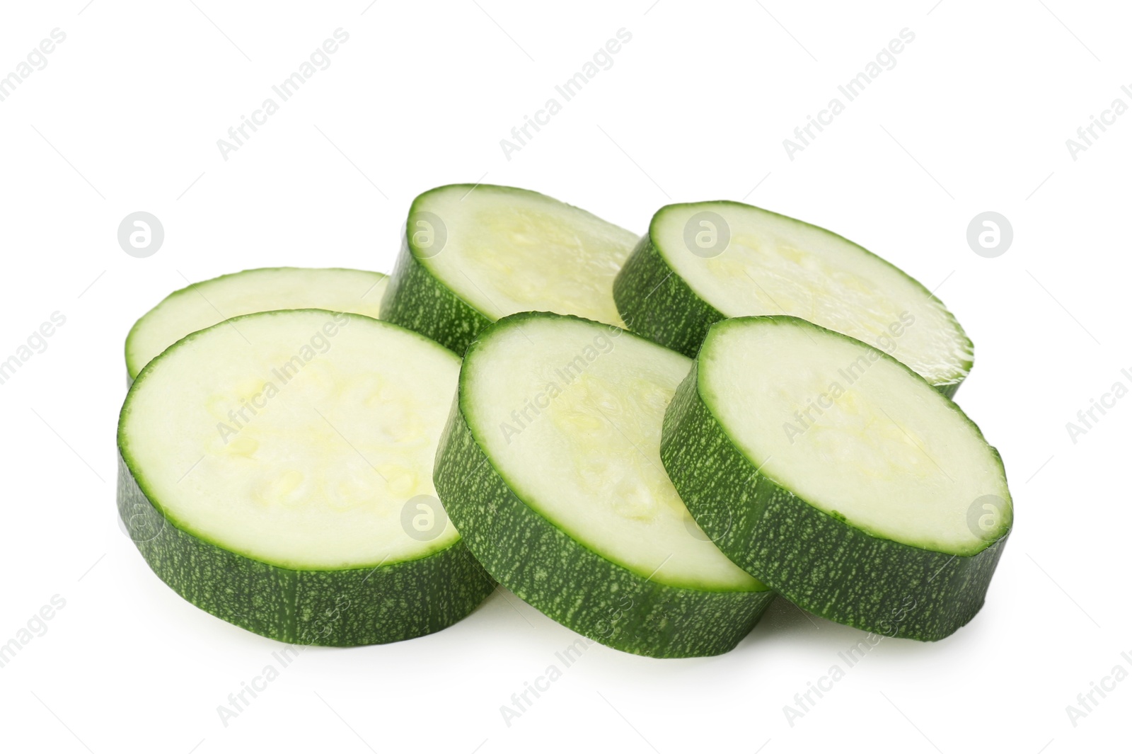 Pieces of fresh zucchini isolated on white Photo of Pieces of fresh zucchini isolated on white
