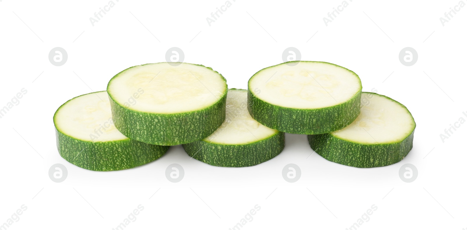 Pieces of fresh zucchini isolated on white Photo of Pieces of fresh zucchini isolated on white