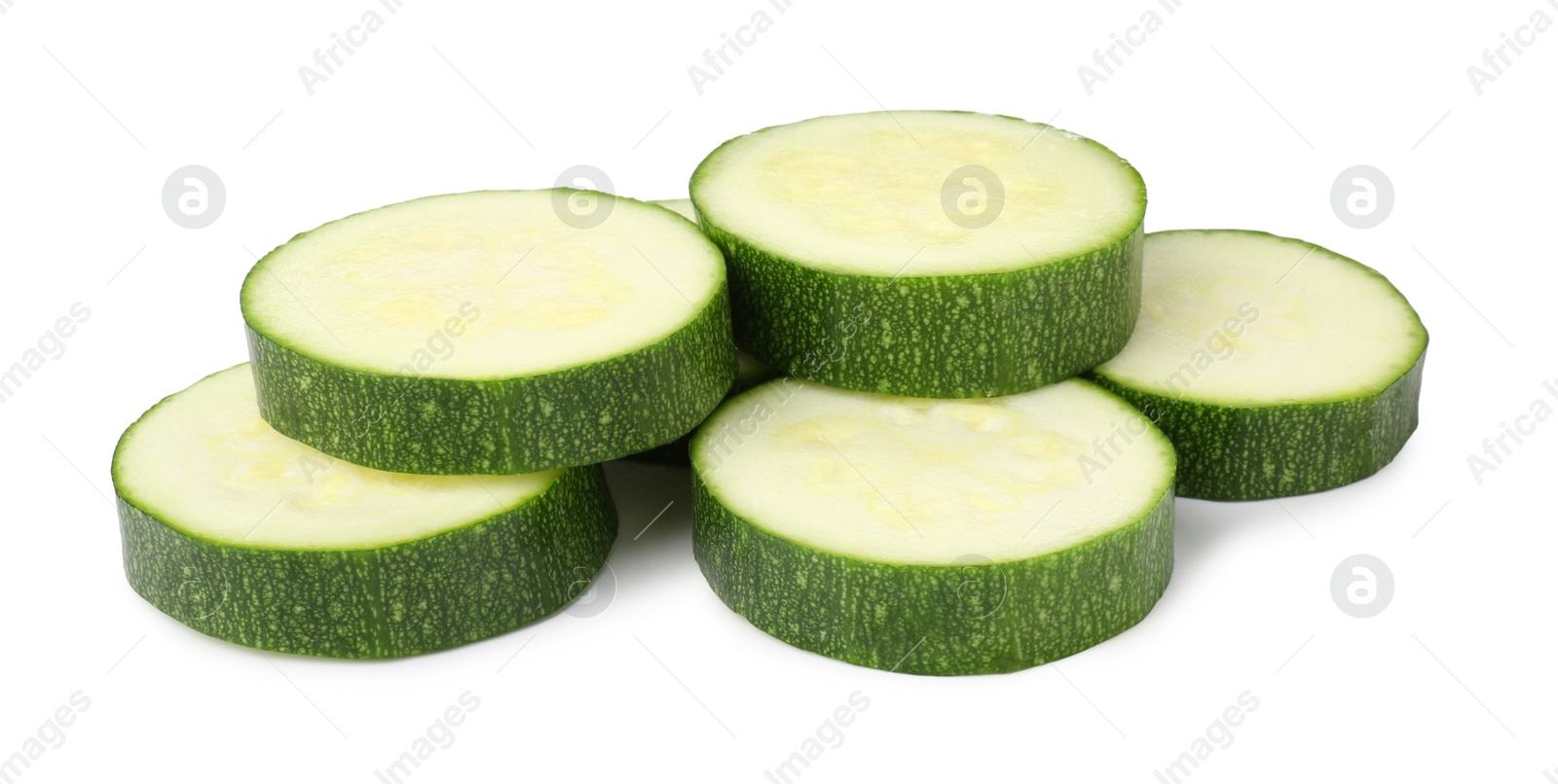 Photo of Pieces of fresh zucchini isolated on white
