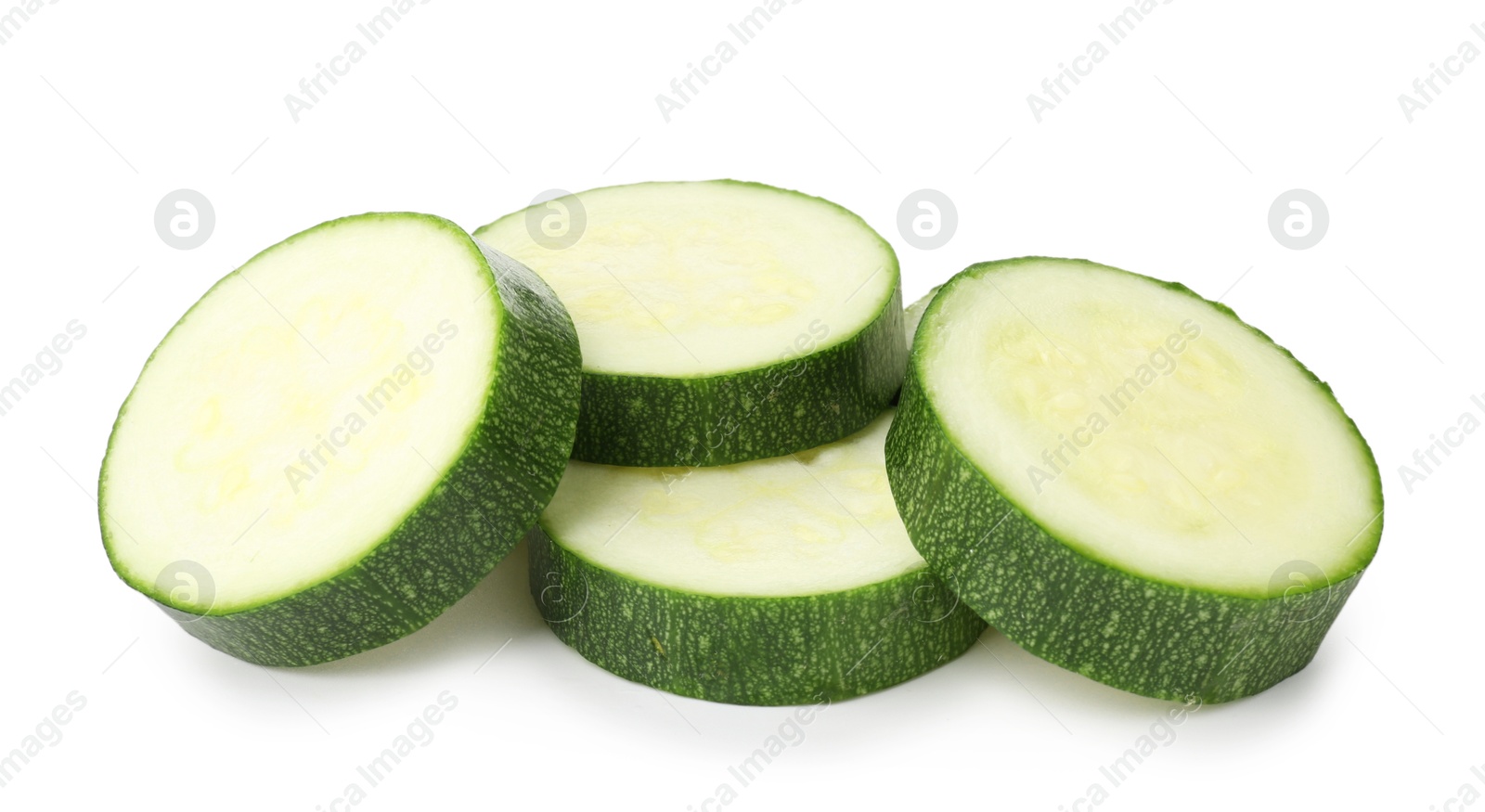 Photo of Pieces of fresh zucchini isolated on white