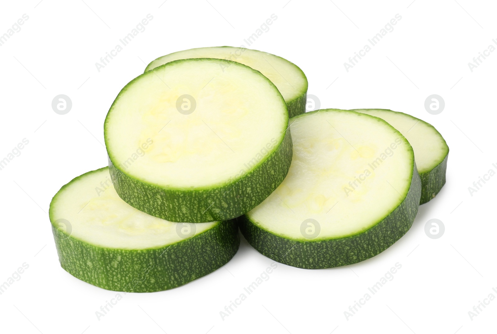 Photo of Pieces of fresh zucchini isolated on white