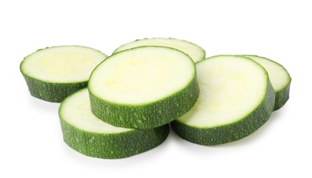 Photo of Pieces of fresh zucchini isolated on white