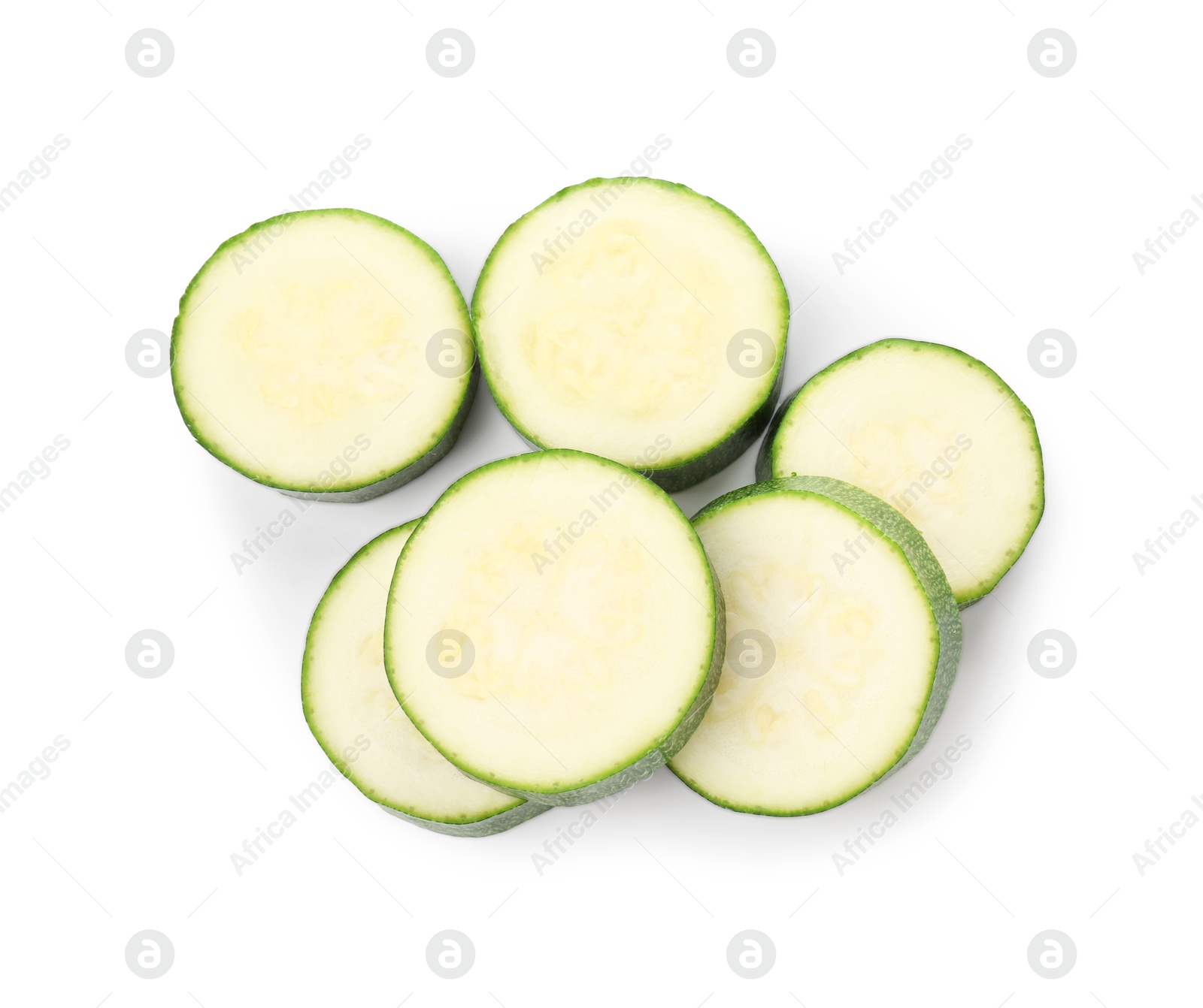 Pieces of fresh zucchini isolated on white, top view Photo of Pieces of fresh zucchini isolated on white, top view