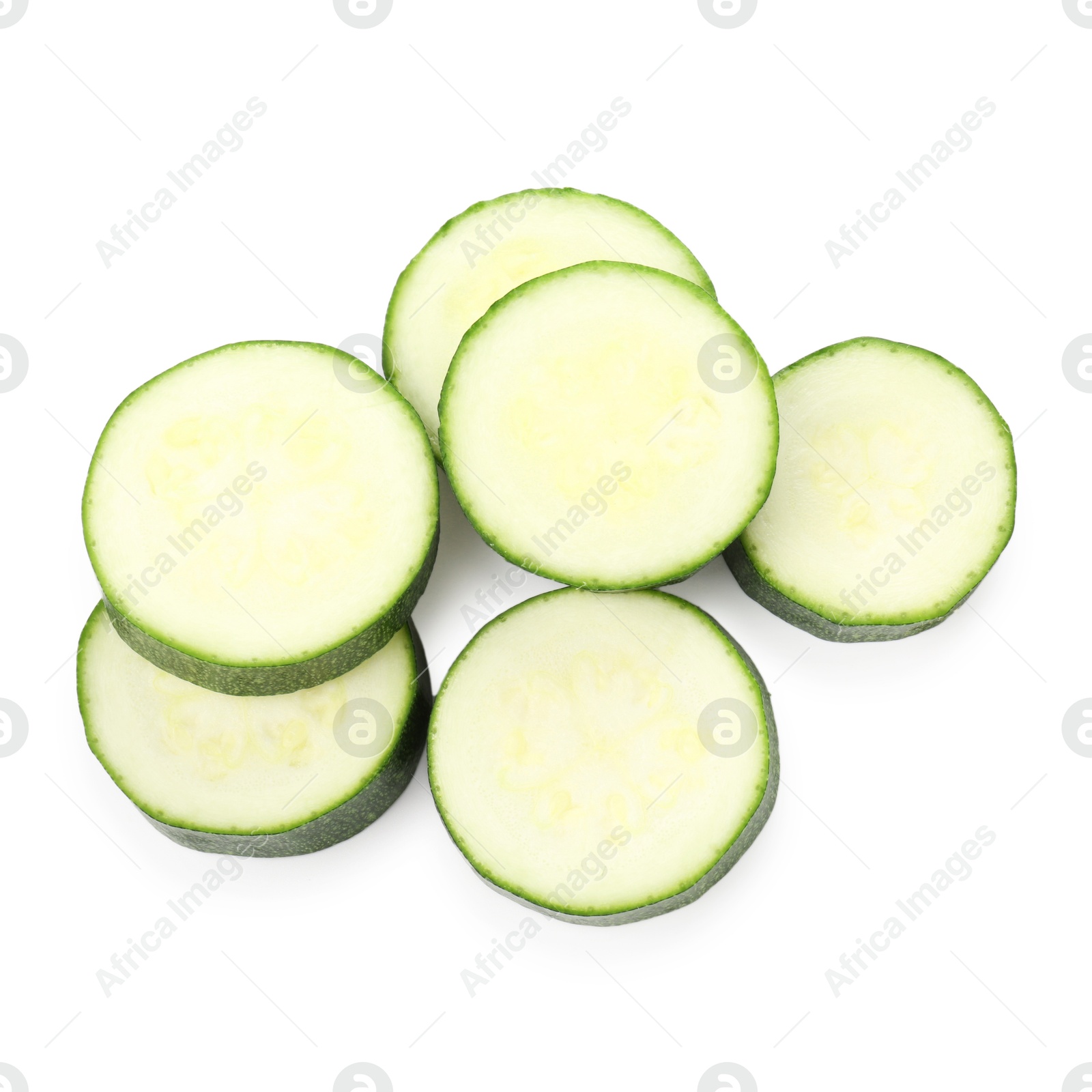 Pieces of fresh zucchini isolated on white, top view Photo of Pieces of fresh zucchini isolated on white, top view
