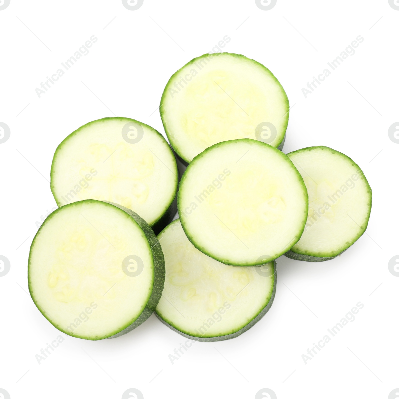 Pieces of fresh zucchini isolated on white, top view Photo of Pieces of fresh zucchini isolated on white, top view
