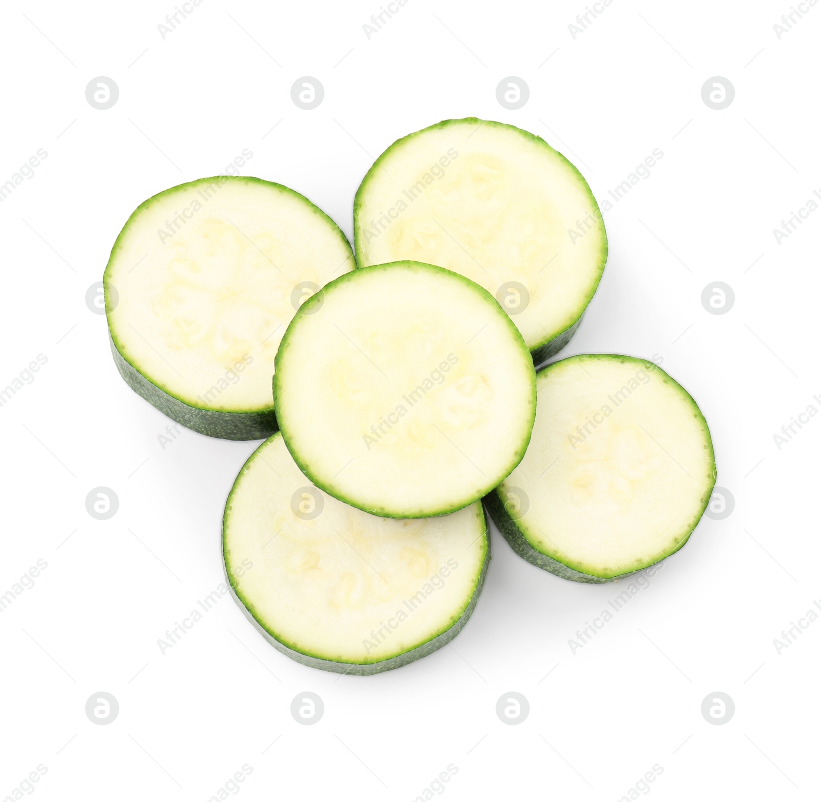 Pieces of fresh zucchini isolated on white, top view Photo of Pieces of fresh zucchini isolated on white, top view