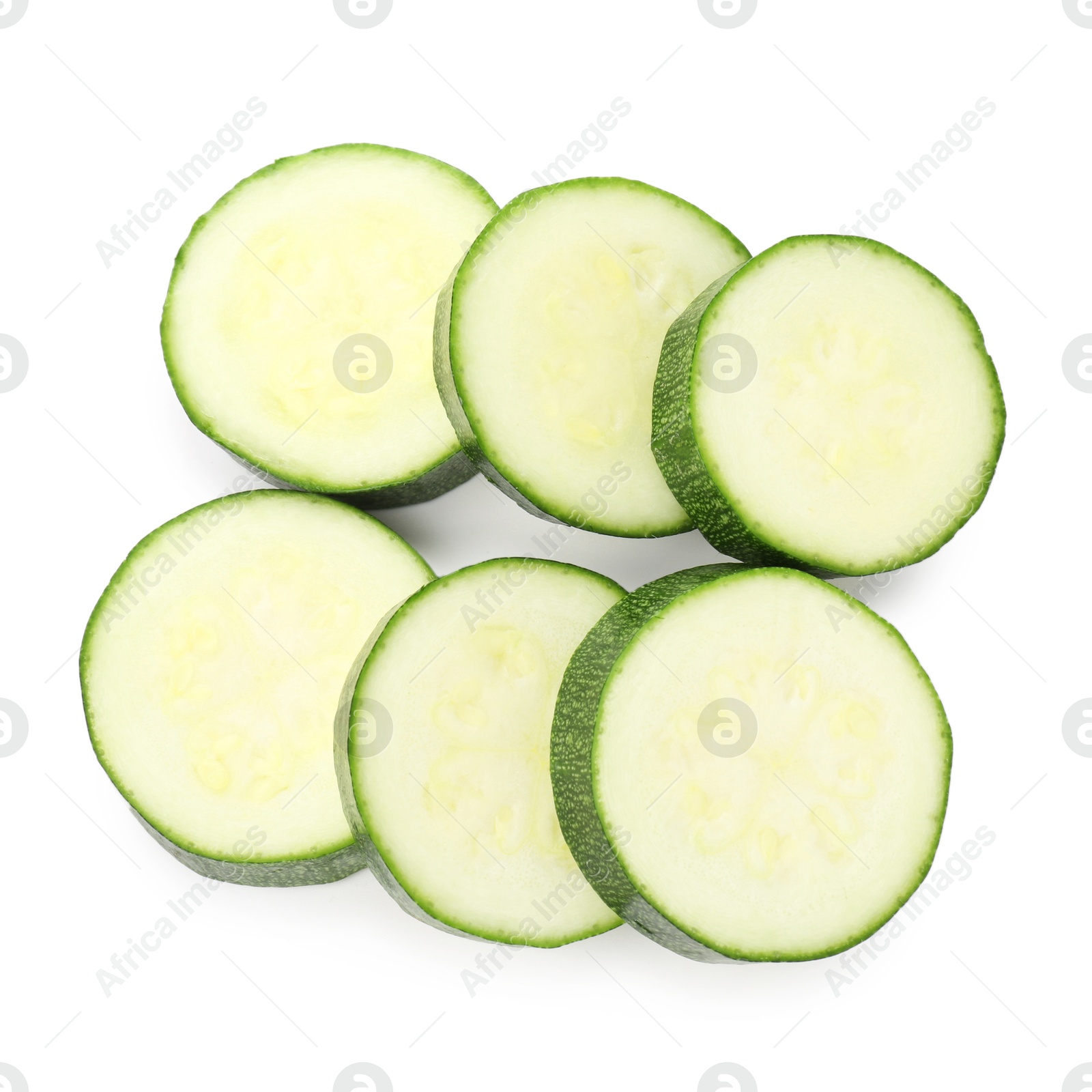 Pieces of fresh zucchini isolated on white, top view Photo of Pieces of fresh zucchini isolated on white, top view