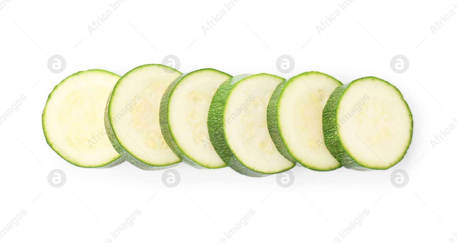 Pieces of fresh zucchini isolated on white, top view Photo of Pieces of fresh zucchini isolated on white, top view