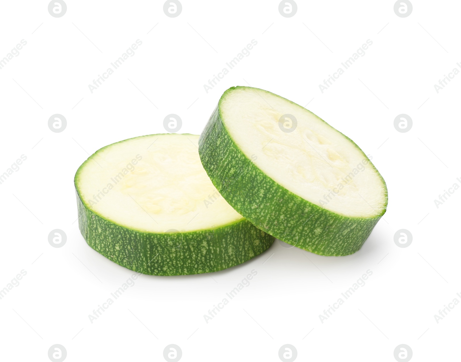 Pieces of fresh zucchini isolated on white Photo of Pieces of fresh zucchini isolated on white