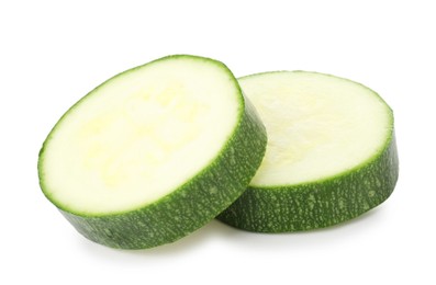 Photo of Pieces of fresh zucchini isolated on white