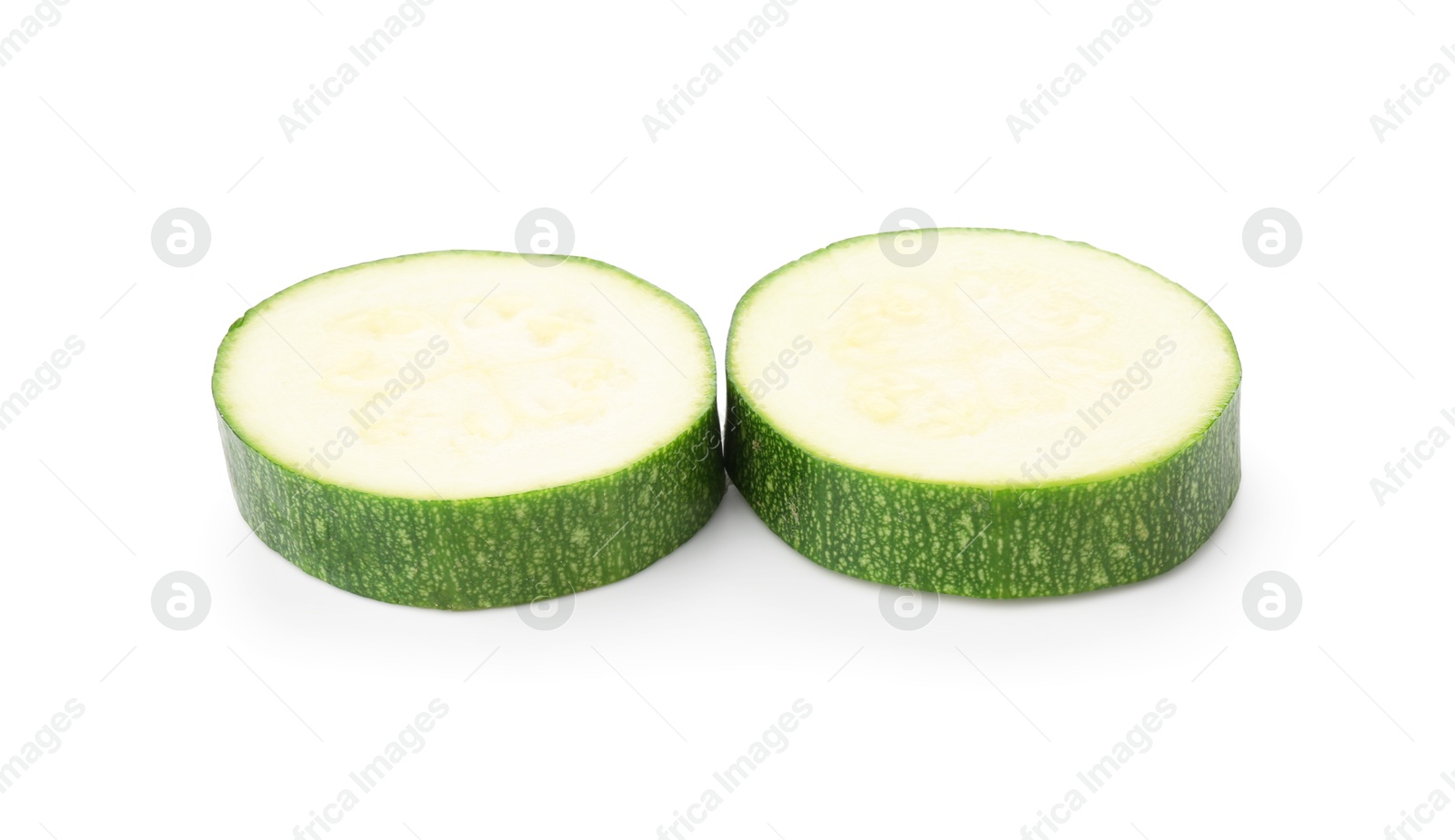 Photo of Pieces of fresh zucchini isolated on white