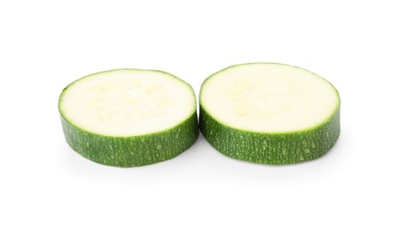 Photo of Pieces of fresh zucchini isolated on white