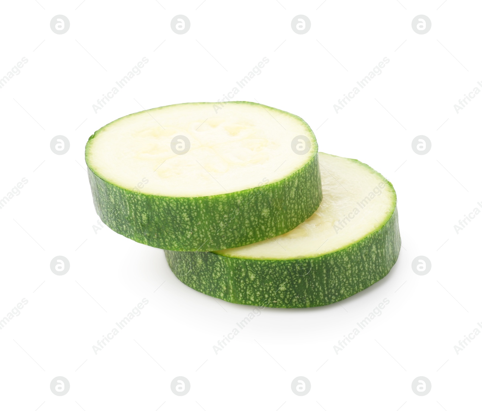 Pieces of fresh zucchini isolated on white Photo of Pieces of fresh zucchini isolated on white