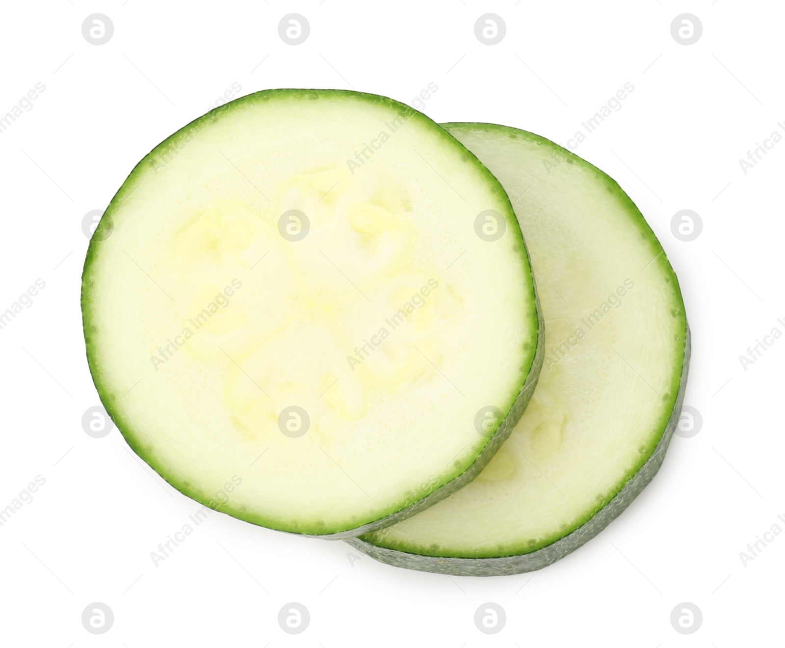 Pieces of fresh zucchini isolated on white, top view Photo of Pieces of fresh zucchini isolated on white, top view