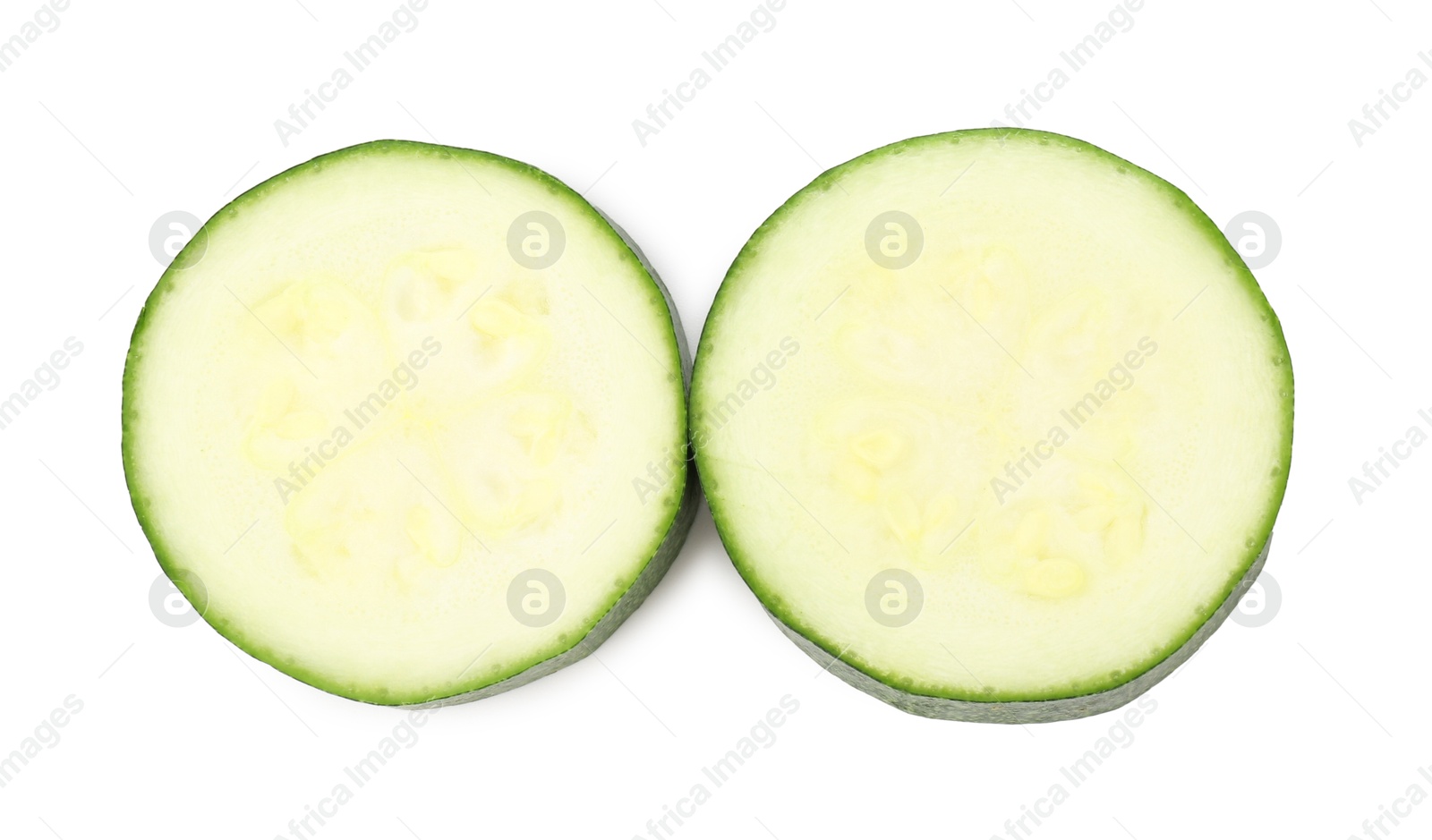 Pieces of fresh zucchini isolated on white, top view Photo of Pieces of fresh zucchini isolated on white, top view
