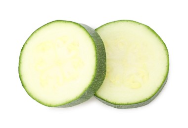 Photo of Pieces of fresh zucchini isolated on white, top view