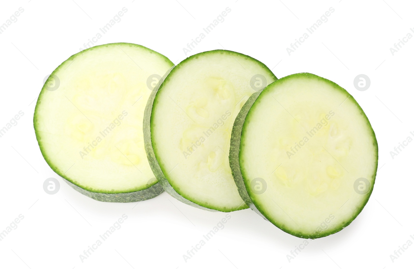 Pieces of fresh zucchini isolated on white, top view Photo of Pieces of fresh zucchini isolated on white, top view